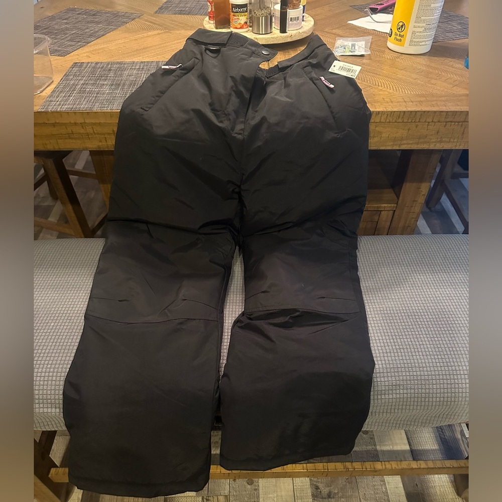 Youth size 14-16 insulated and waterproof snow pants. New with tags